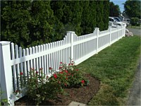 <b>Classic white vinyl picket fence with architectural detail</b>